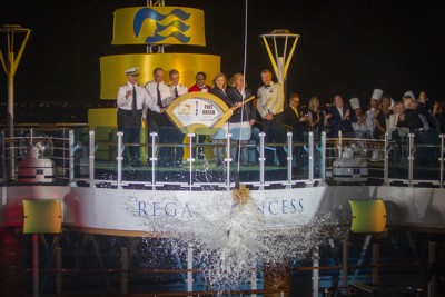 Above, the Nebuchadnezzar-size bottle breaks against the ship. (Photo Carlo Allegri/AP Images for Princess Cruises).
